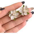 Ivory Flower Stud Earrings with Green Leaf Accents – Elegant & Lightweight